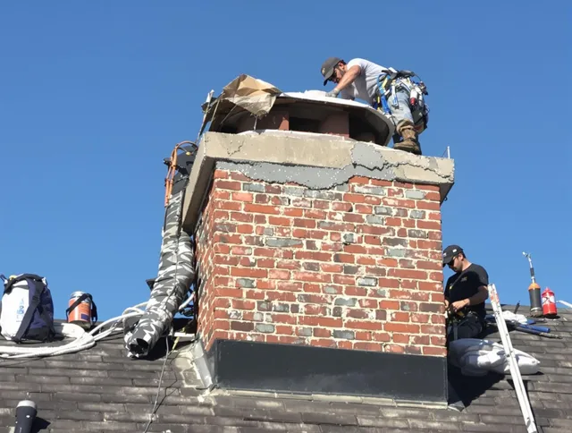 Broadview Heights Chimney Sweep installing a custom chimney crown in Broadview Heights, OH